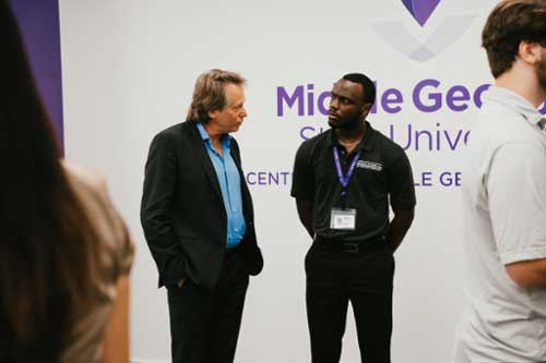 Matthew Stepka speaks with an MGA student after his inaugural Jennings Family Distinguished Lecture Series.